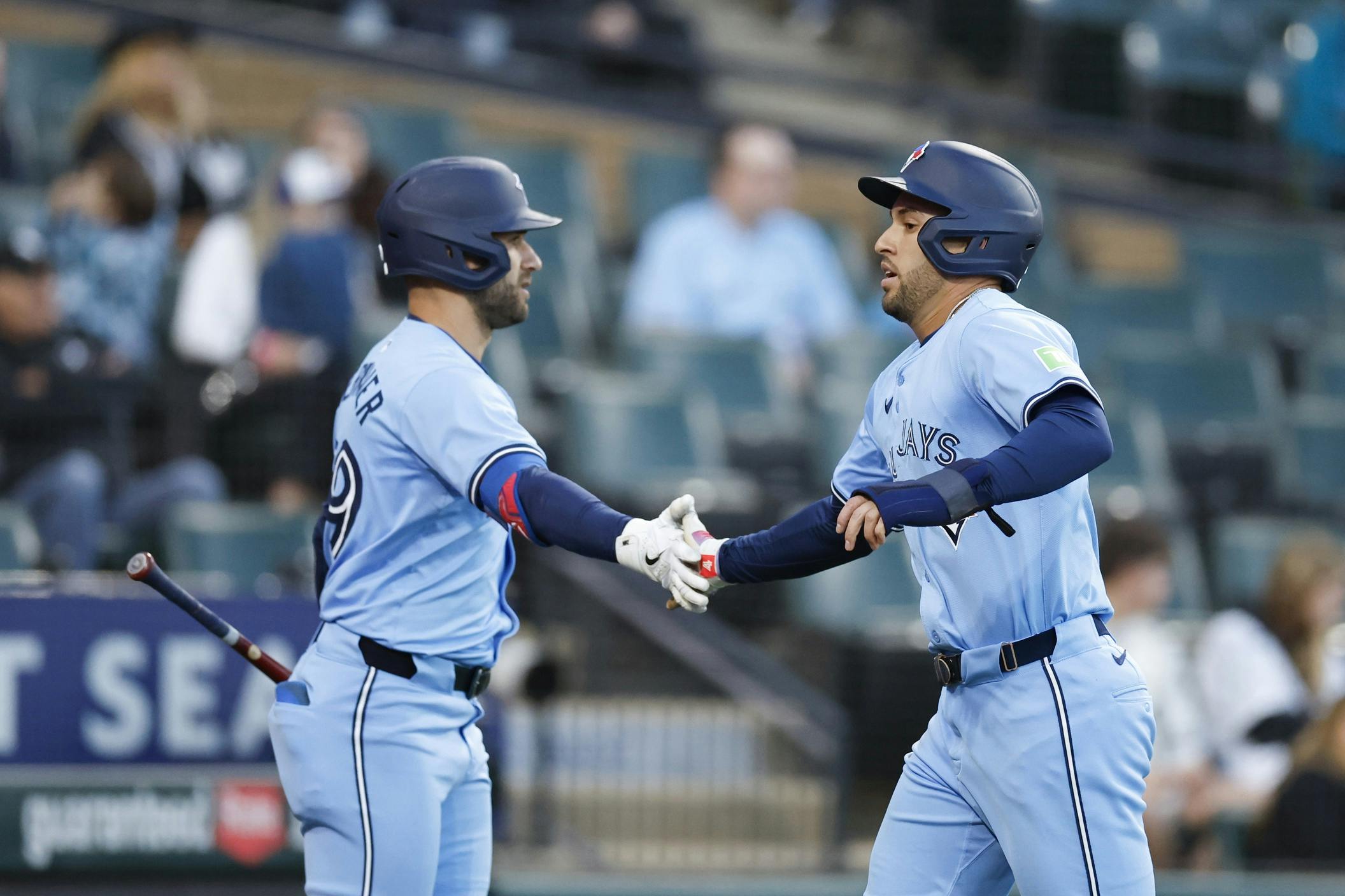 Toronto Blue Jays outfielder George Springer (4) celebrates with outfielder Kevin Kiermaier (39) after scoring against the Chicago White Sox during the fourth inning at Guaranteed Rate Field.