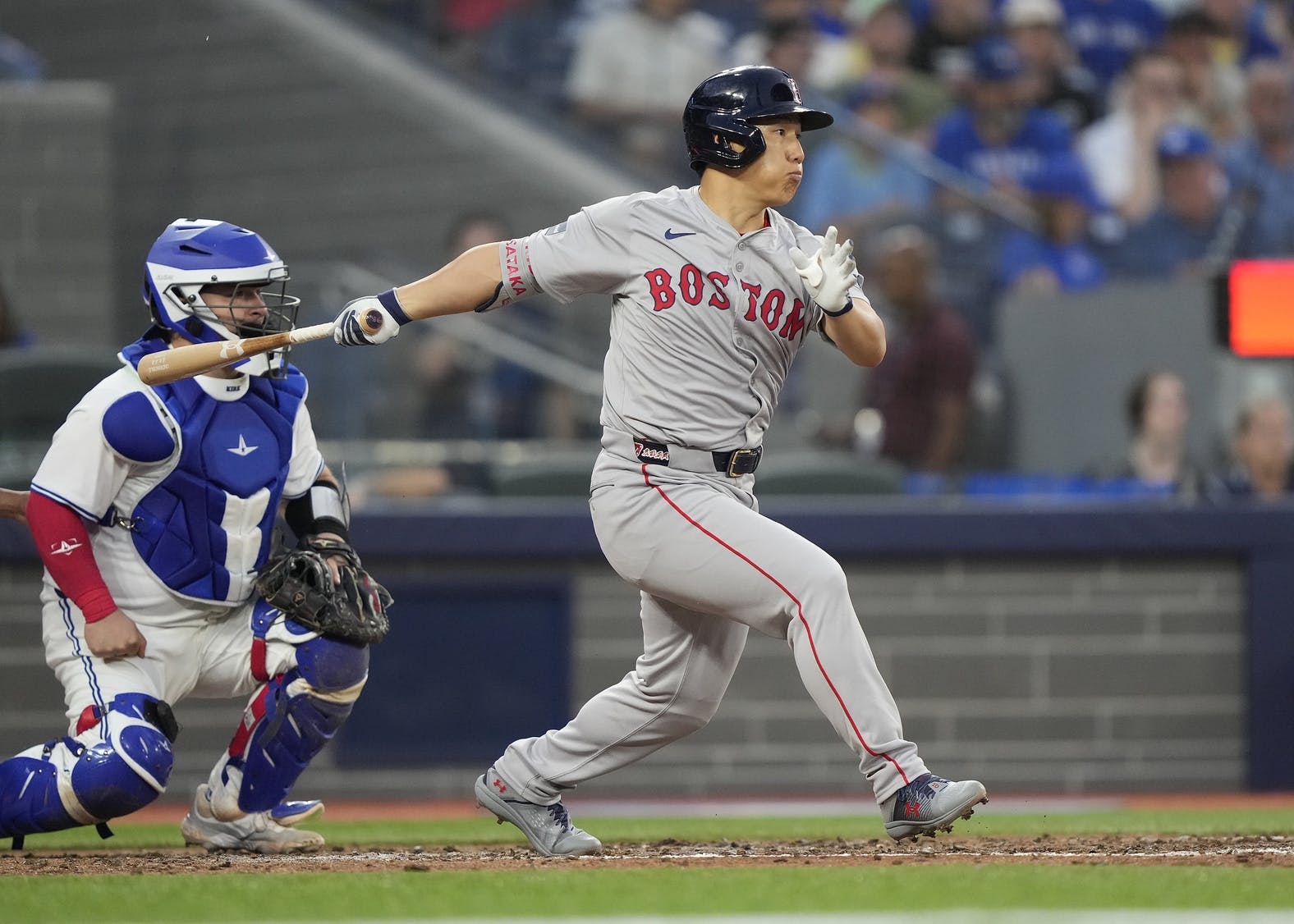 Boston Red Sox designated hitter Masataka Yoshida (7) hits a RBI single against the Toronto Blue Jays during the sixth inning at Rogers Centre.