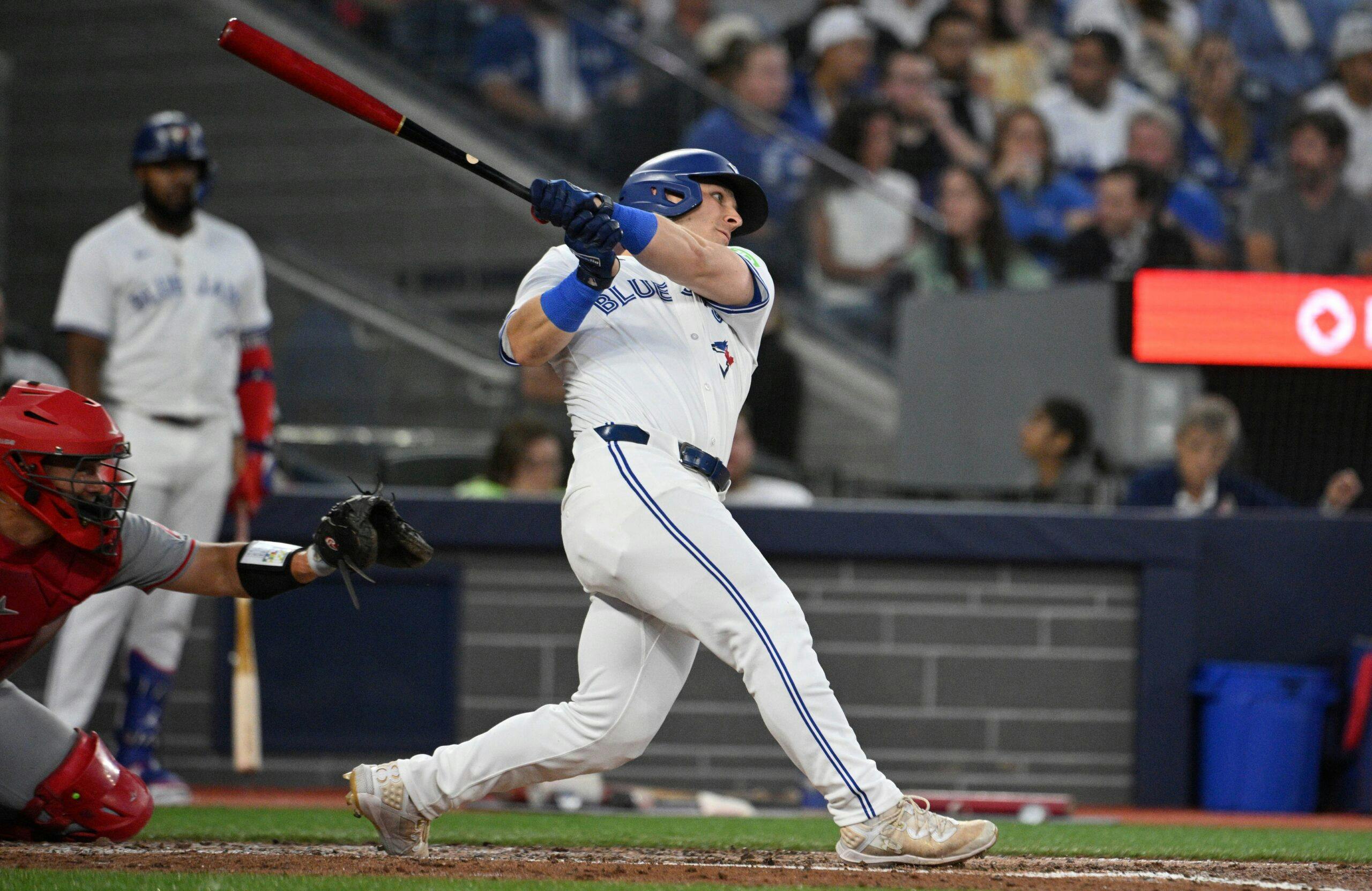 Toronto Blue Jays center fielder Daulton Varsho (25) hits a double against the Los Angeles Angels in the second inning at Rogers Centre.