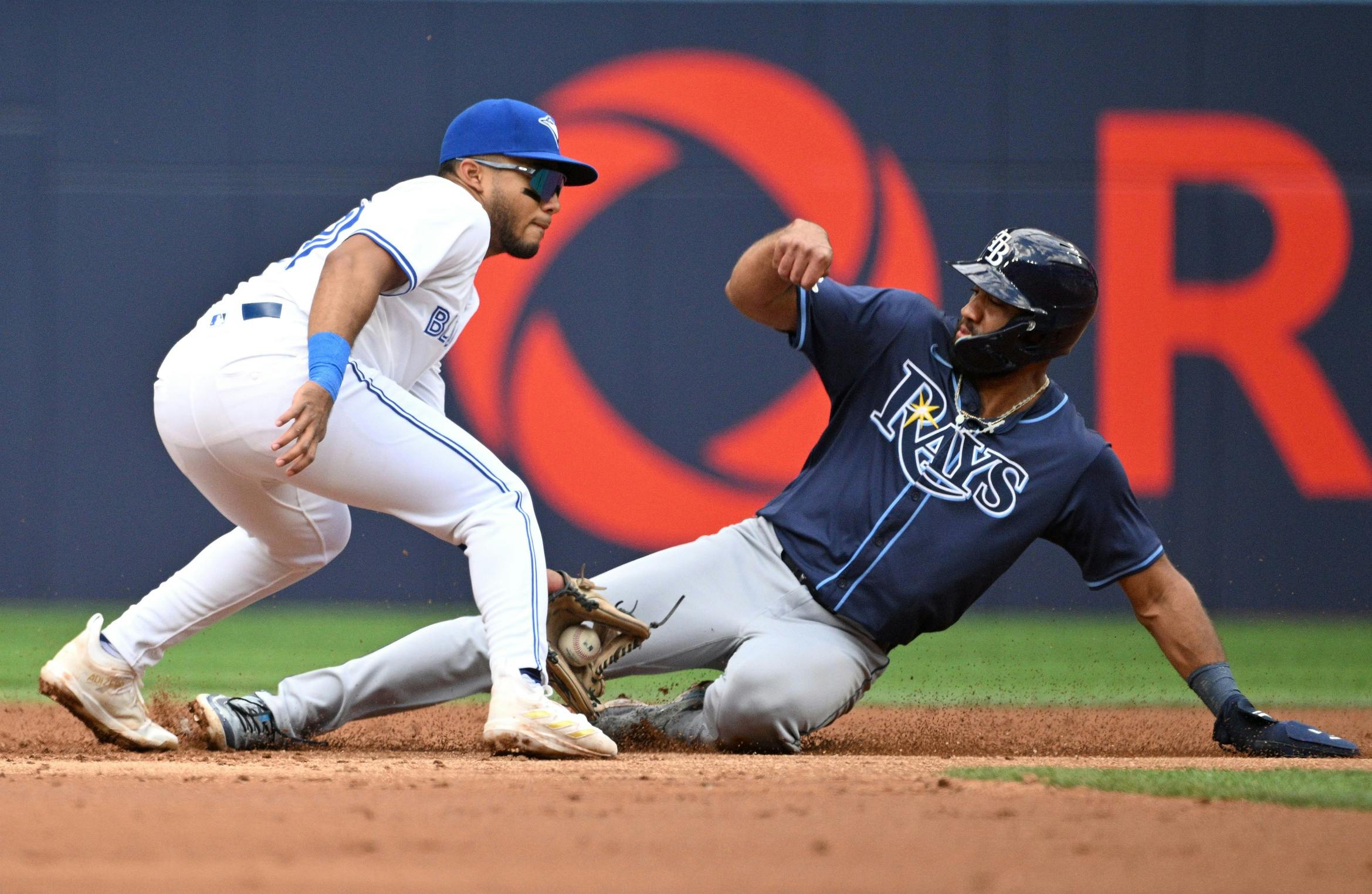 Tampa Bay Rays third baseman Ahmed Rosario (10) steals second base against Toronto Blue Jays shortstop Leo Jimenez (45) in the second inning at Rogers Centre