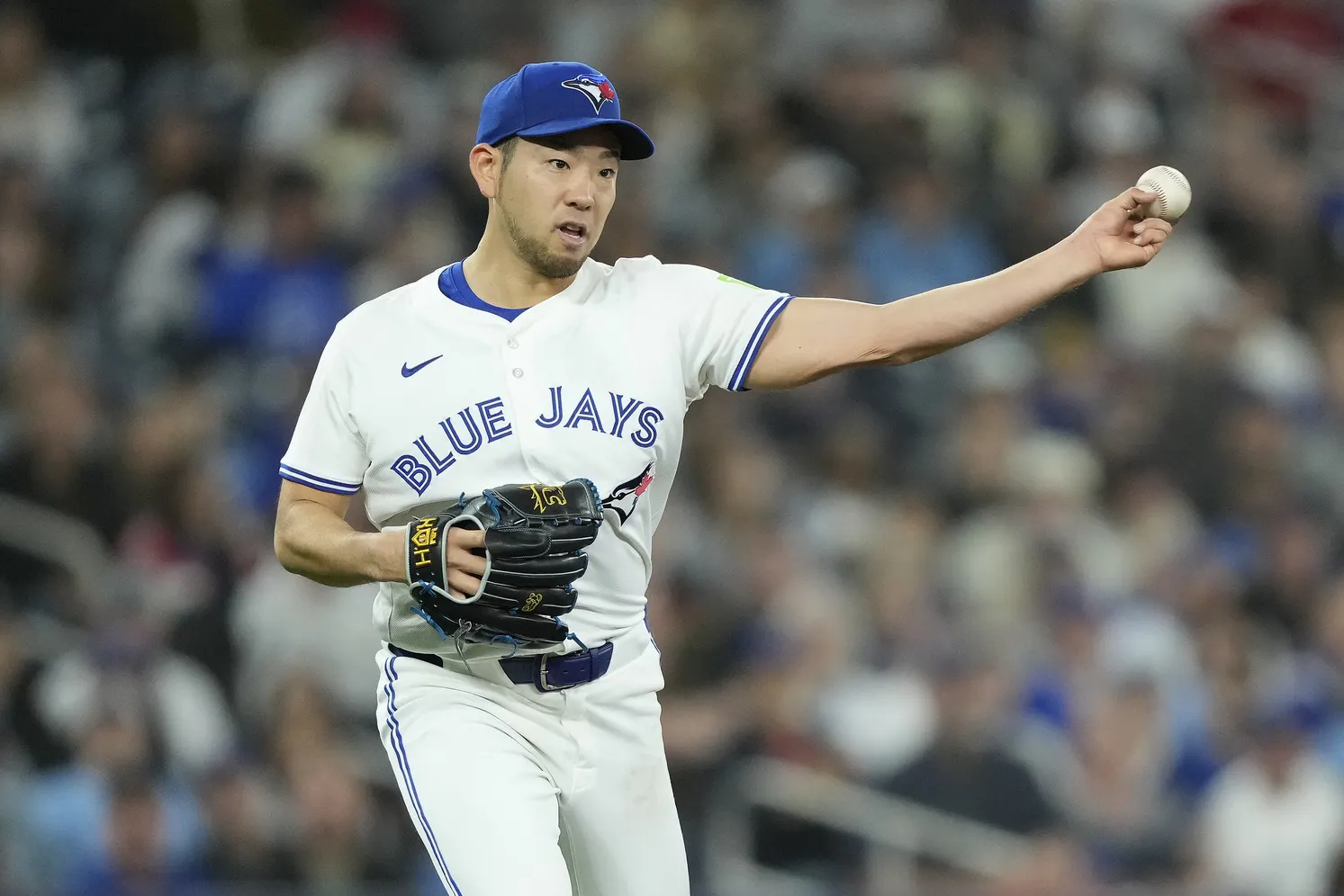 Toronto Blue Jays starting pitcher Yusei Kikuchi (16) throws out New York Yankees third baseman Oswaldo Cabrera (not pictured) at first base on a ground ball during the second inning at Rogers Centre.