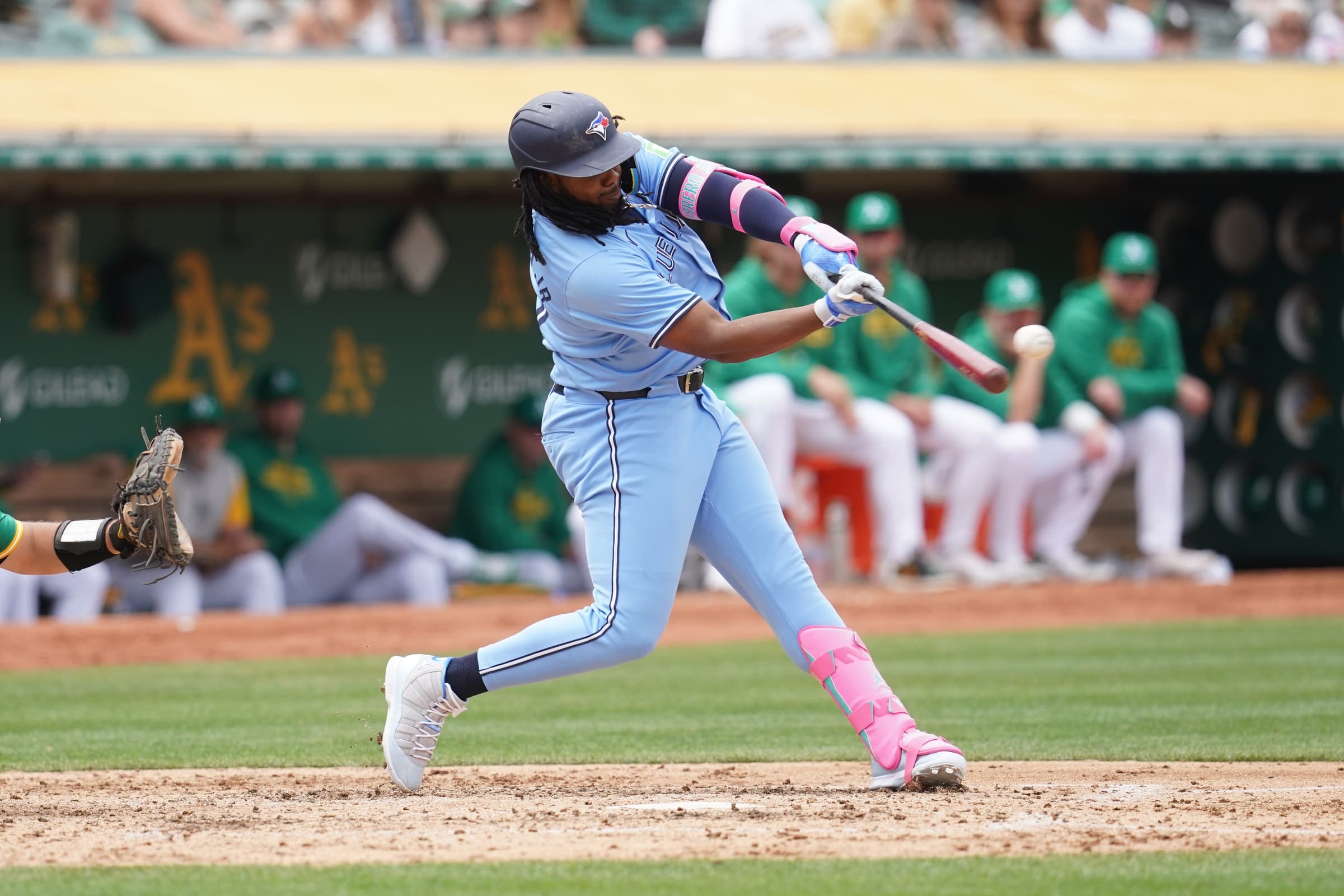 Toronto Blue Jays first baseman Vladimir Guerrero Jr. (27) hits a double against the Oakland Athletics in the fifth inning at Oakland-Alameda County Coliseum.