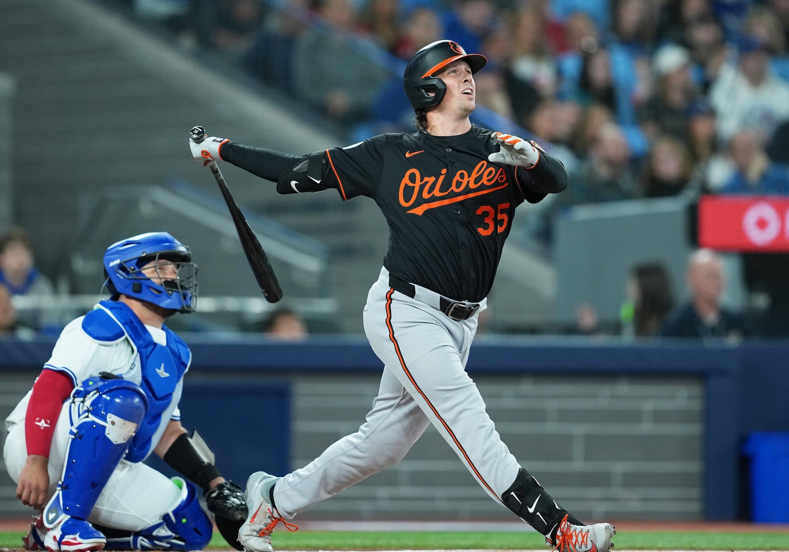Baltimore Orioles catcher Adley Rutschman (35) hits a home run against the Toronto Blue Jays during the first inning at Rogers Centre.