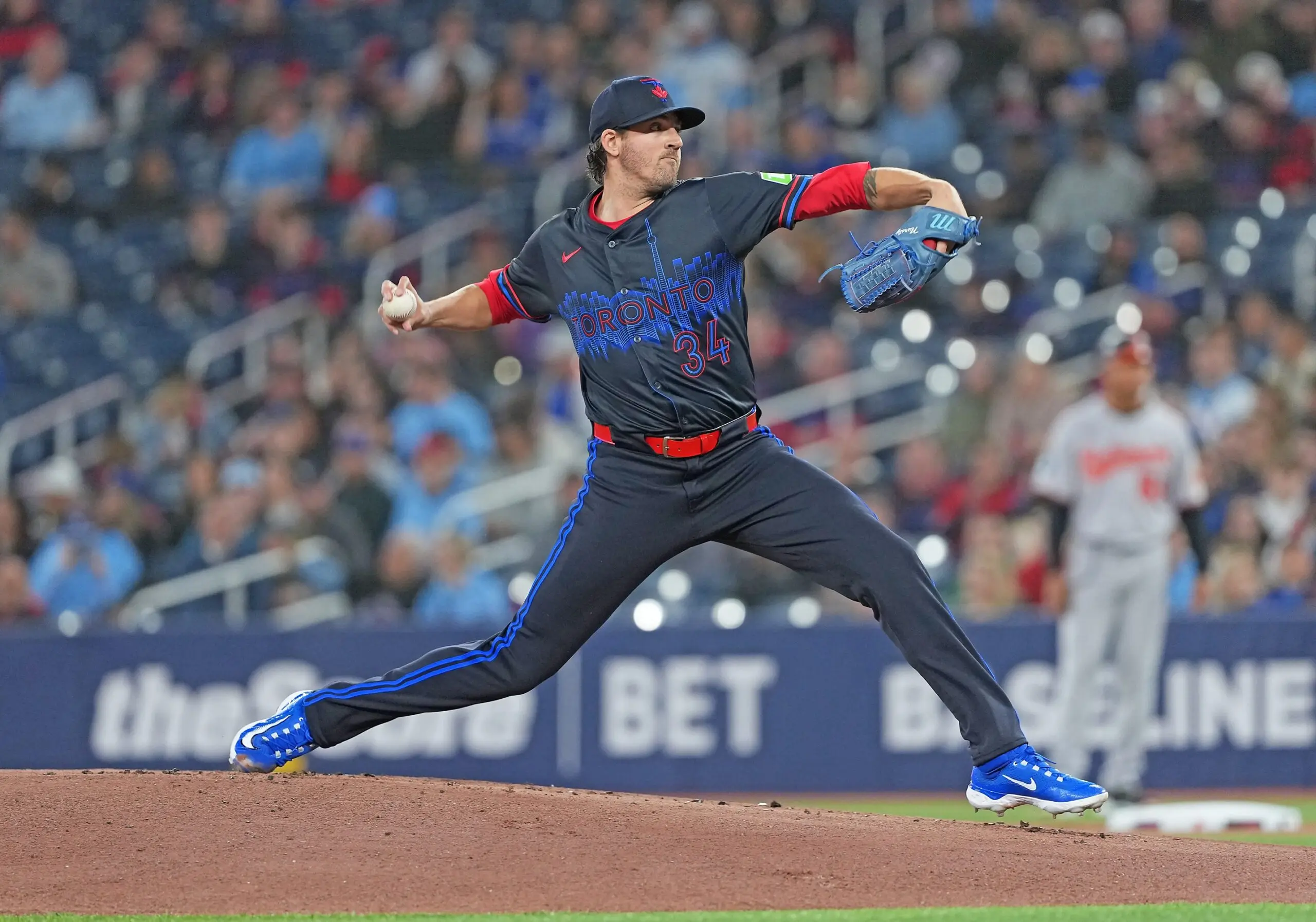 Toronto Blue Jays starting pitcher Kevin Gausman (34) throws a pitch against the Baltimore Orioles during the first inning at Rogers Centre.