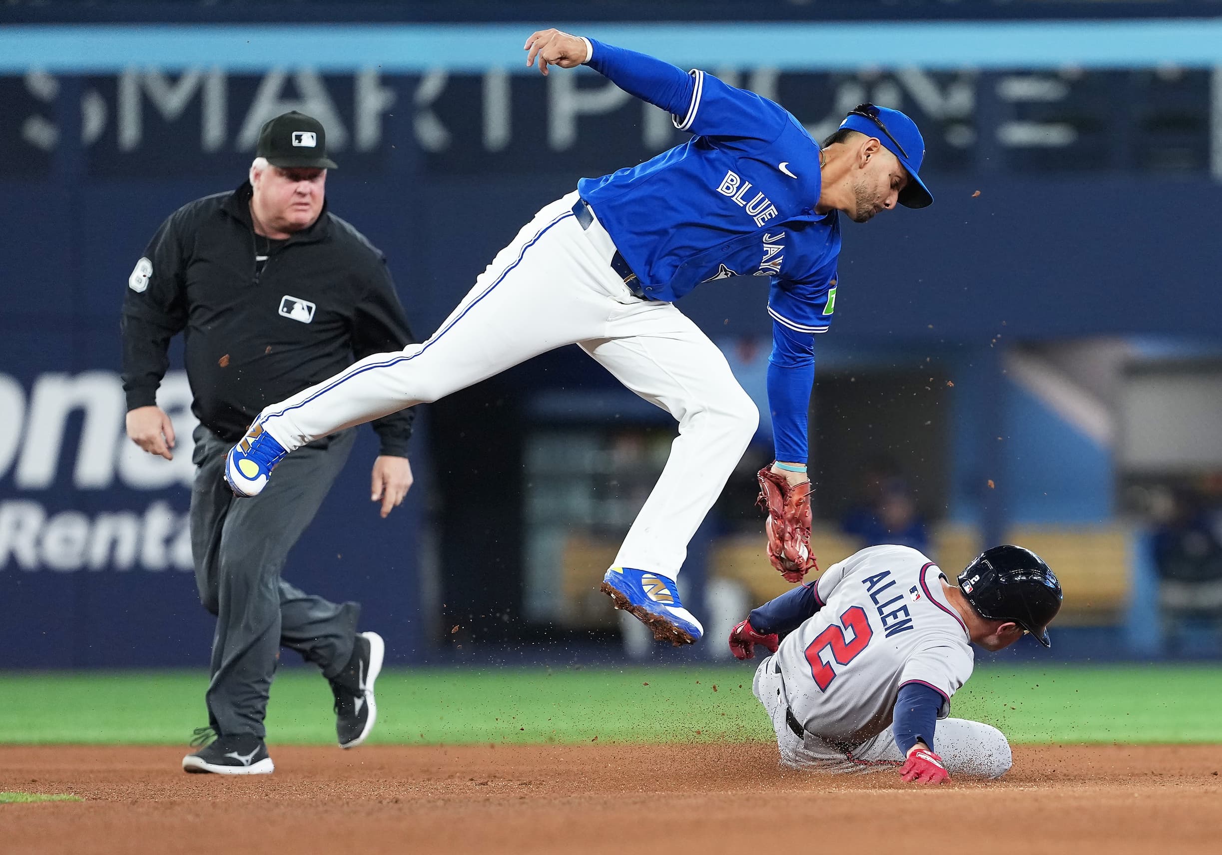 Atlanta Braves shortstop Nick Allen (2) steals second base ahead of the tag from Toronto Blue Jays second baseman Andres Gimenez (0) during the fifth inning at Rogers Centre