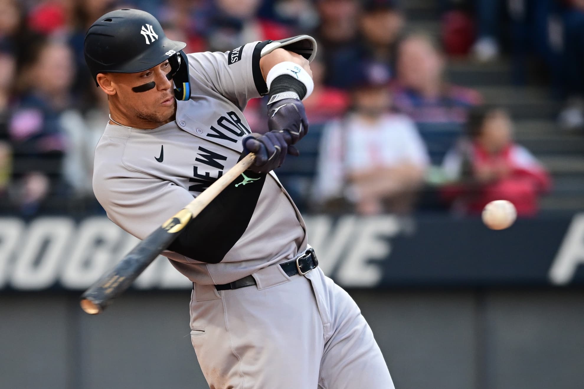 New York Yankees right fielder Aaron Judge (99) hits a double during the third inning against the Cleveland Guardians at Progressive Field.