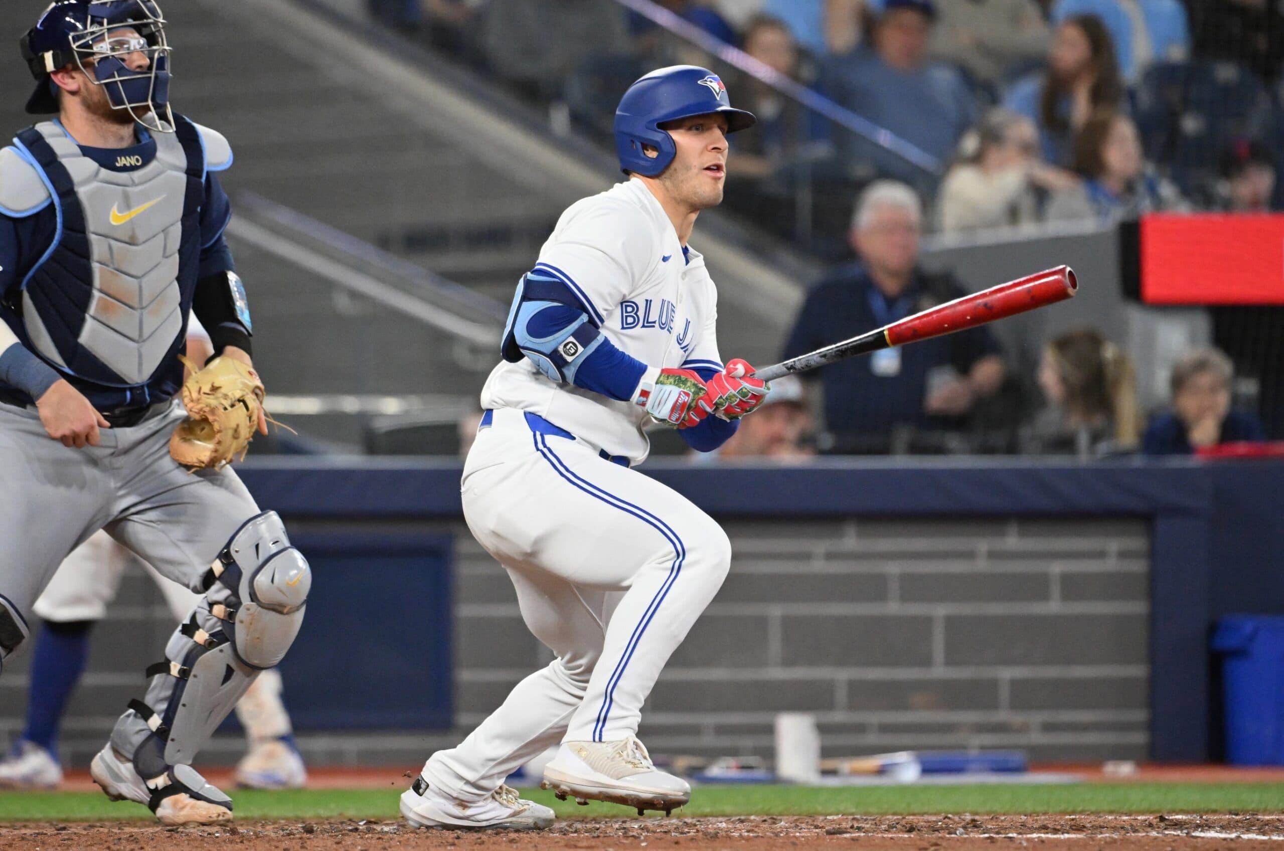Toronto Blue Jays center fielder Daulton Varsho (5) hits a single against the Tampa Bay Rays in the sixth inning at Rogers Centre.
