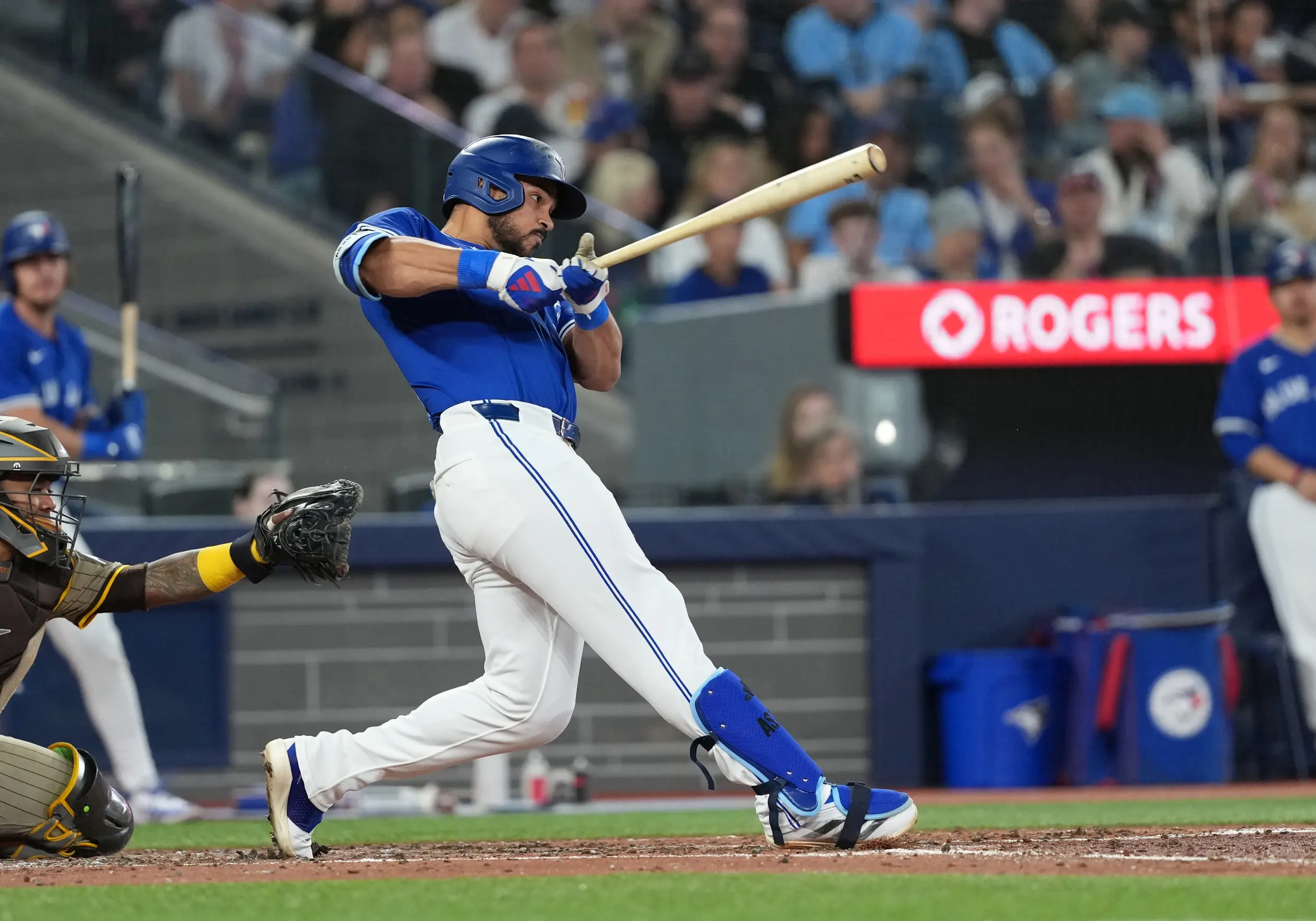 Toronto Blue Jays designated hitter Anthony Santander (25) hits a two-run home run against the San Diego Padres during the fifth inning at Rogers Centre.