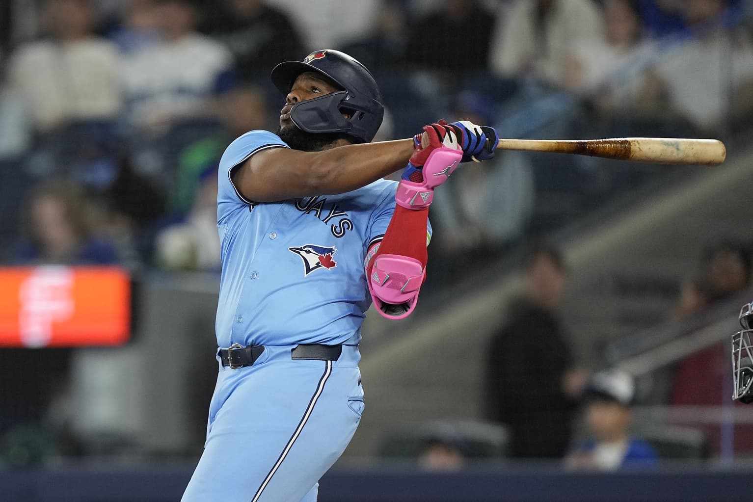 Toronto Blue Jays first baseman Vladimir Guerrero (27) hits a two run home run against the Athletics during the second inning at Rogers Centre