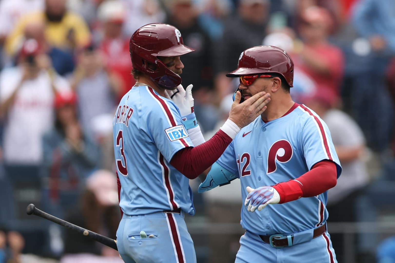 Philadelphia Phillies designated hitter Kyle Schwarber (12) celebrates his home run with first base Bryce Harper (3) during the seventh inning against the Colorado Rockies at Citizens Bank Park.