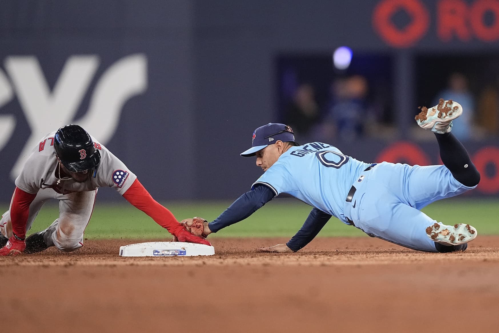 Boston Red Sox center fielder Ceddanne Rafaela (3) steals second base against Toronto Blue Jays second baseman Andres Gimenez (0) during the second inning at Rogers Centre.