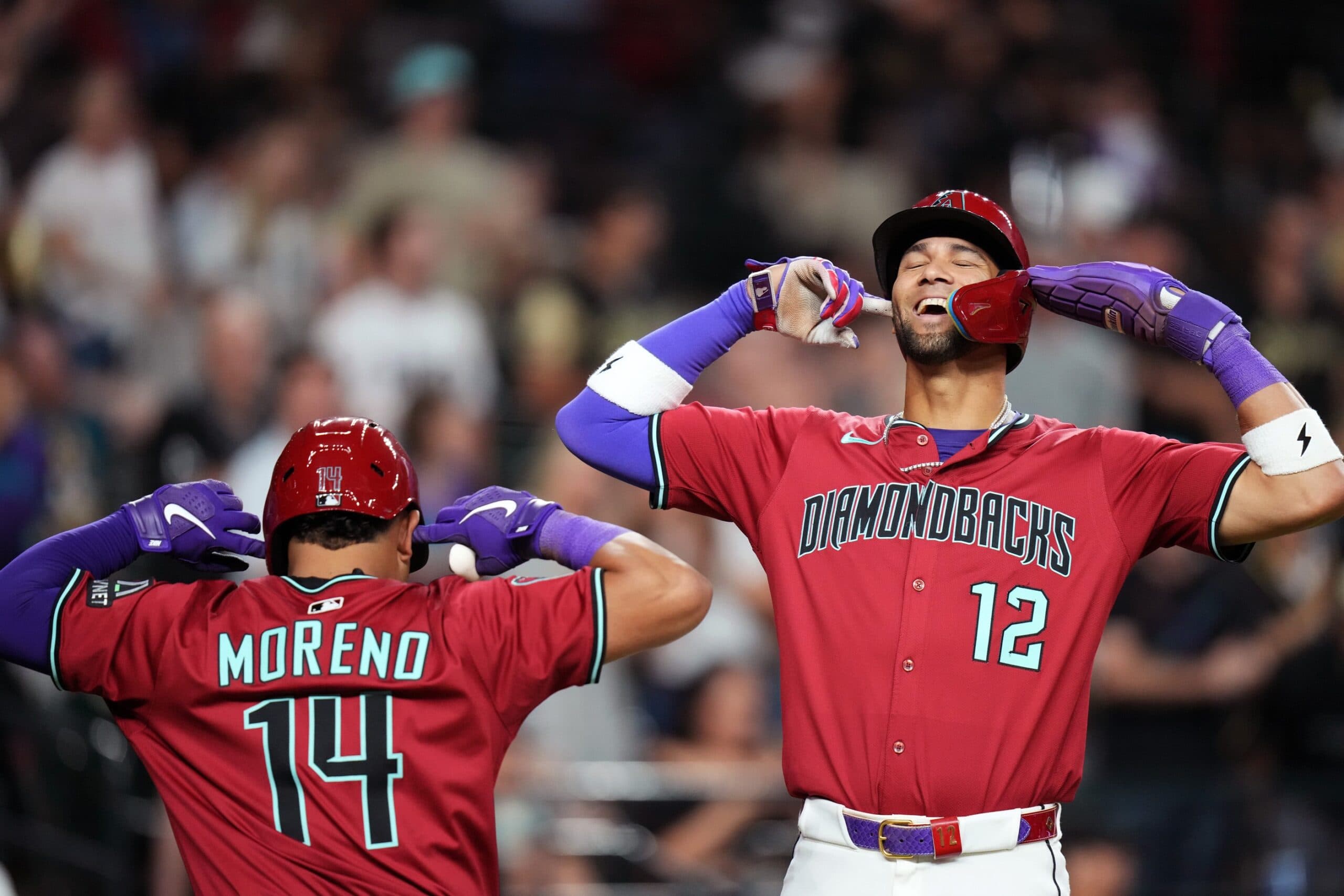 Arizona Diamondbacks’ Gabriel Moreno (14) celebrates his 3-run home run with teammate Lourdes Gurriel Jr. (12) during their game against the Seattle Mariners at Chase Field in Phoenix, on June 10, 2025.