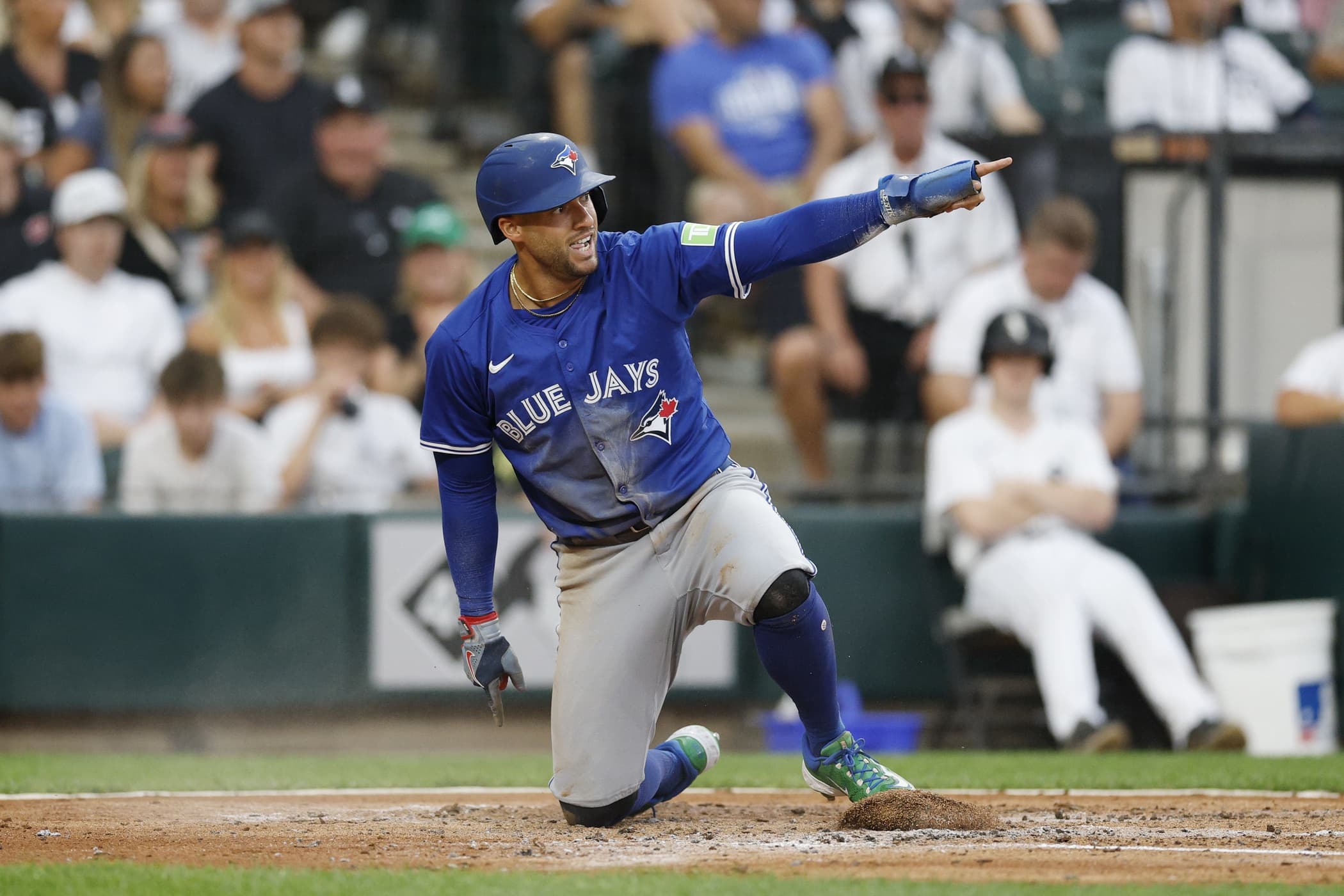 Toronto Blue Jays designated hitter George Springer (4) reacts after scoring against the Chicago White Sox during the third inning at Rate Field.