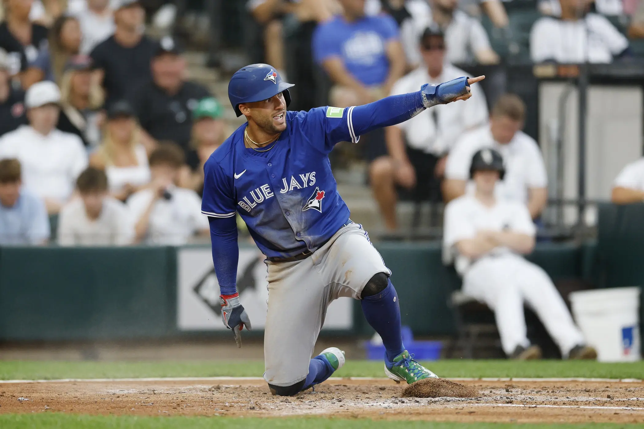 Toronto Blue Jays designated hitter George Springer (4) reacts after scoring against the Chicago White Sox during the third inning at Rate Field