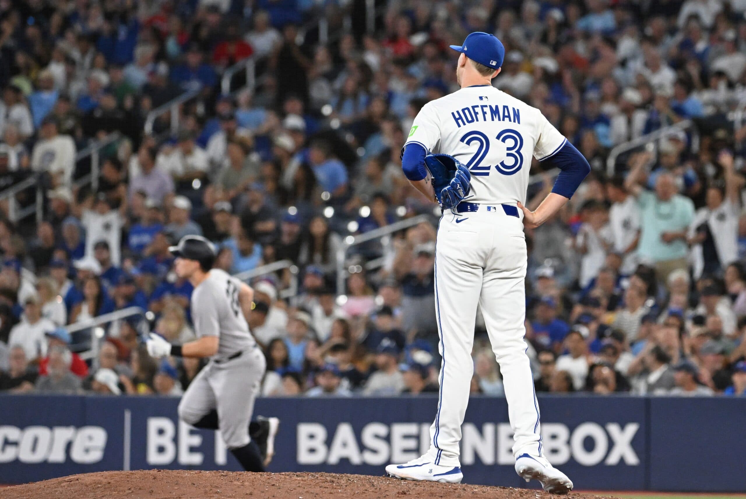 Toronto Blue Jays relief pitcher Jeff Hoffman (23) watches New York Yankees first baseman Ben Rice (22) round the bases after hitting a solo home run in the ninth inning at Rogers Centre