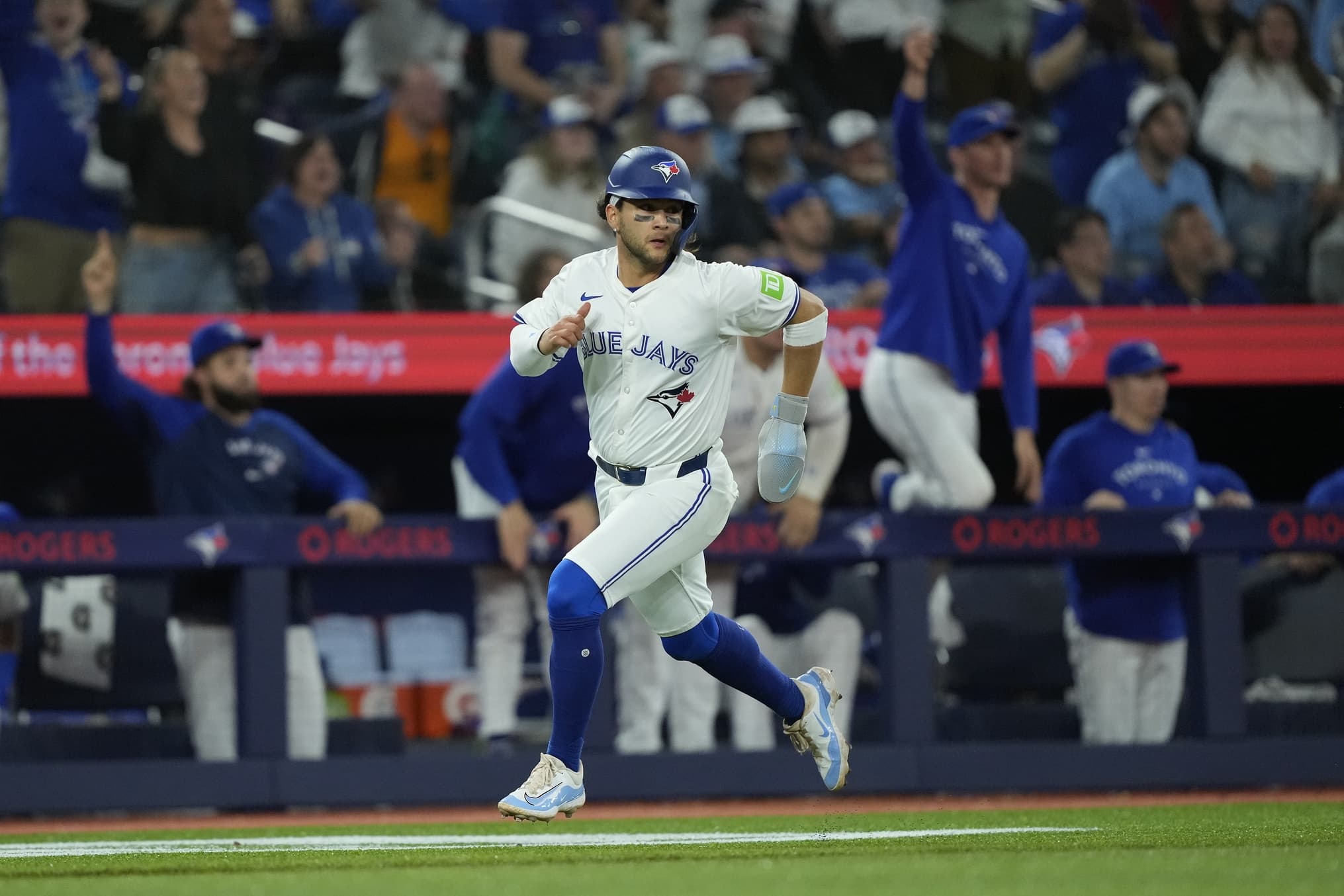 Toronto Blue Jays shortstop Bo Bichette (11) scores on a single by second baseman Isiah Kiner-Falefa (not pictured) against the Minnesota Twins during the ninth inning at Rogers Centre.