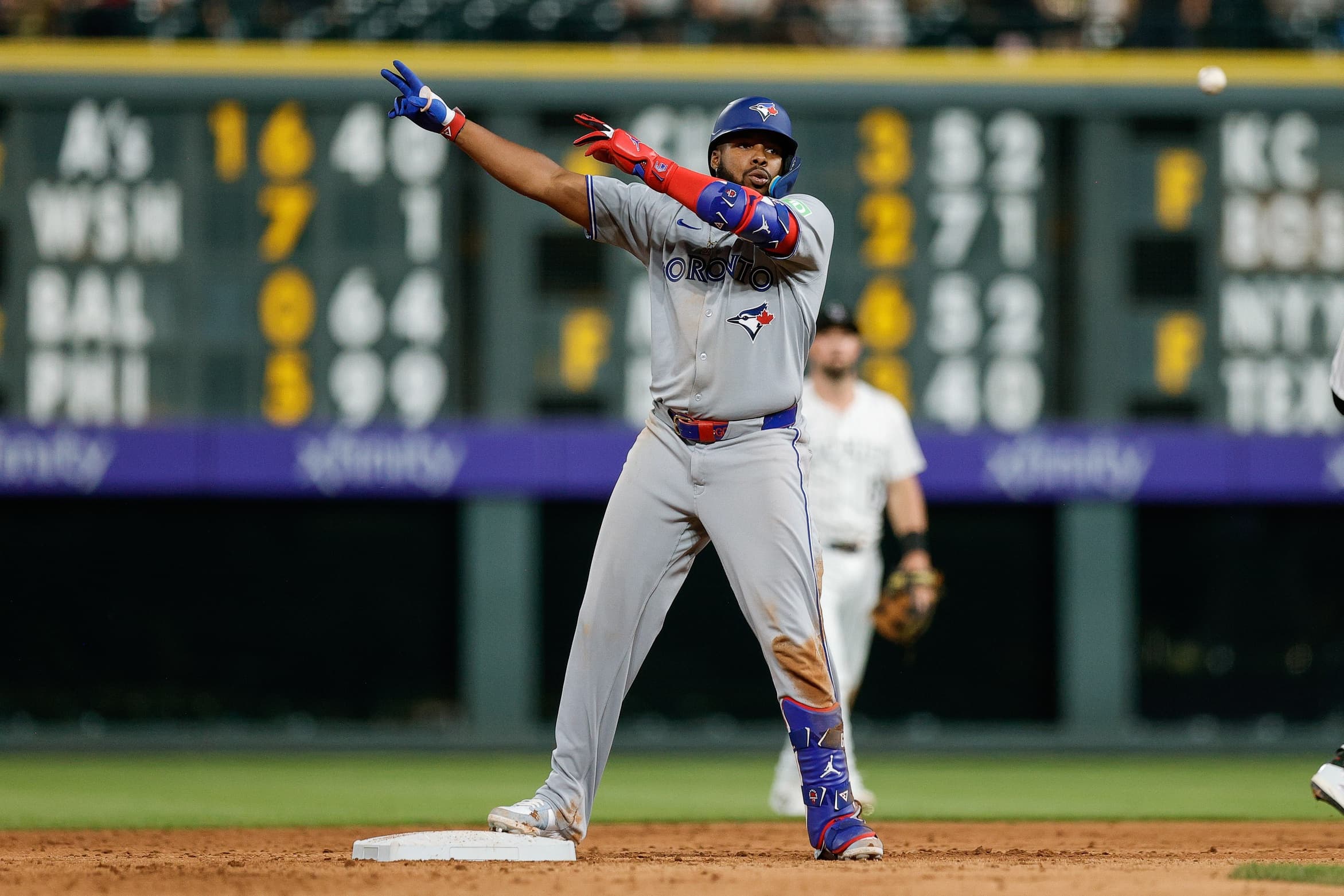 Toronto Blue Jays first baseman Vladimir Guerrero Jr. (27) reacts from second on an RBI double in the ninth inning against the Colorado Rockies at Coors Field.