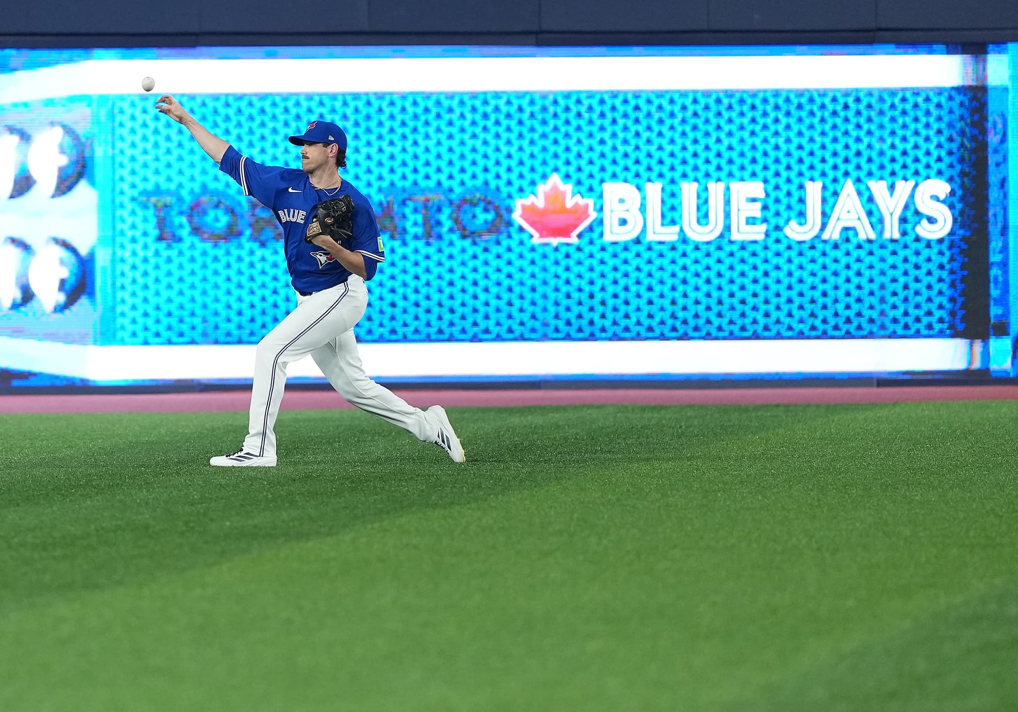 Toronto Blue Jays pitcher Shane Bieber (57) throws balls during batting practice before a game against the Chicago Cubs at Rogers Centre.