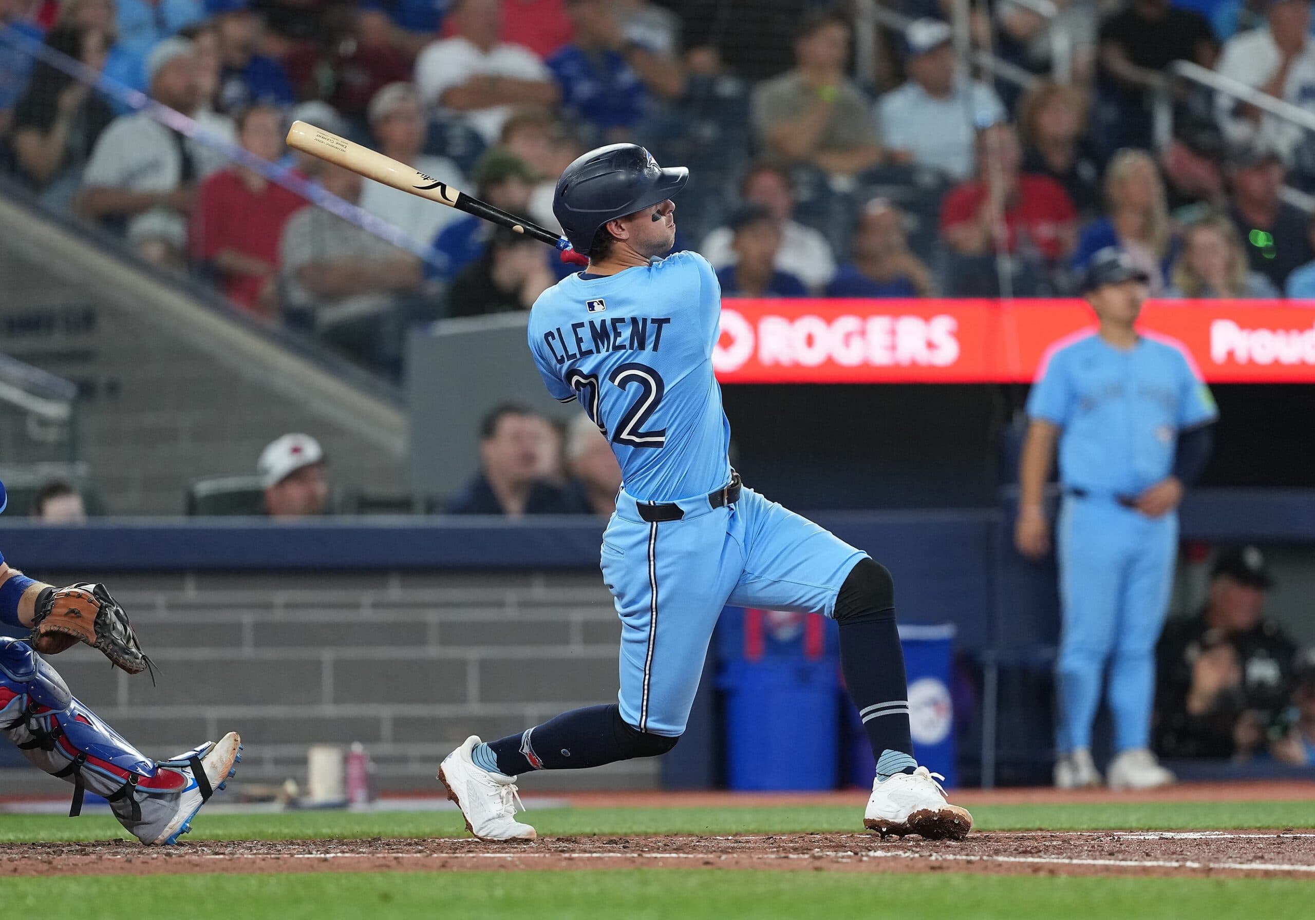 Toronto Blue Jays third baseman Ernie Clement (22) hits a three run home run against the Chicago Cubs during the fourth inning at Rogers Centre.