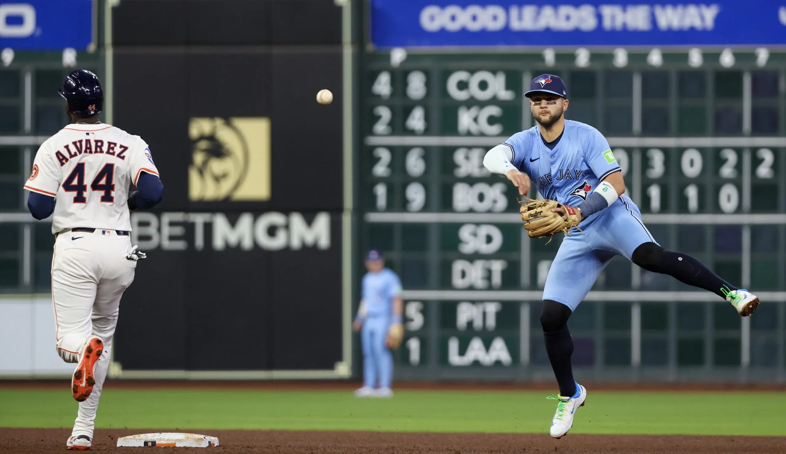 Toronto Blue Jays shortstop Bo Bichette (11) forces Houston Astros designated hitter Yordan Alvarez (44) out at second base but is not enough to turn the double play in time in the fifth inning at Daikin Park.