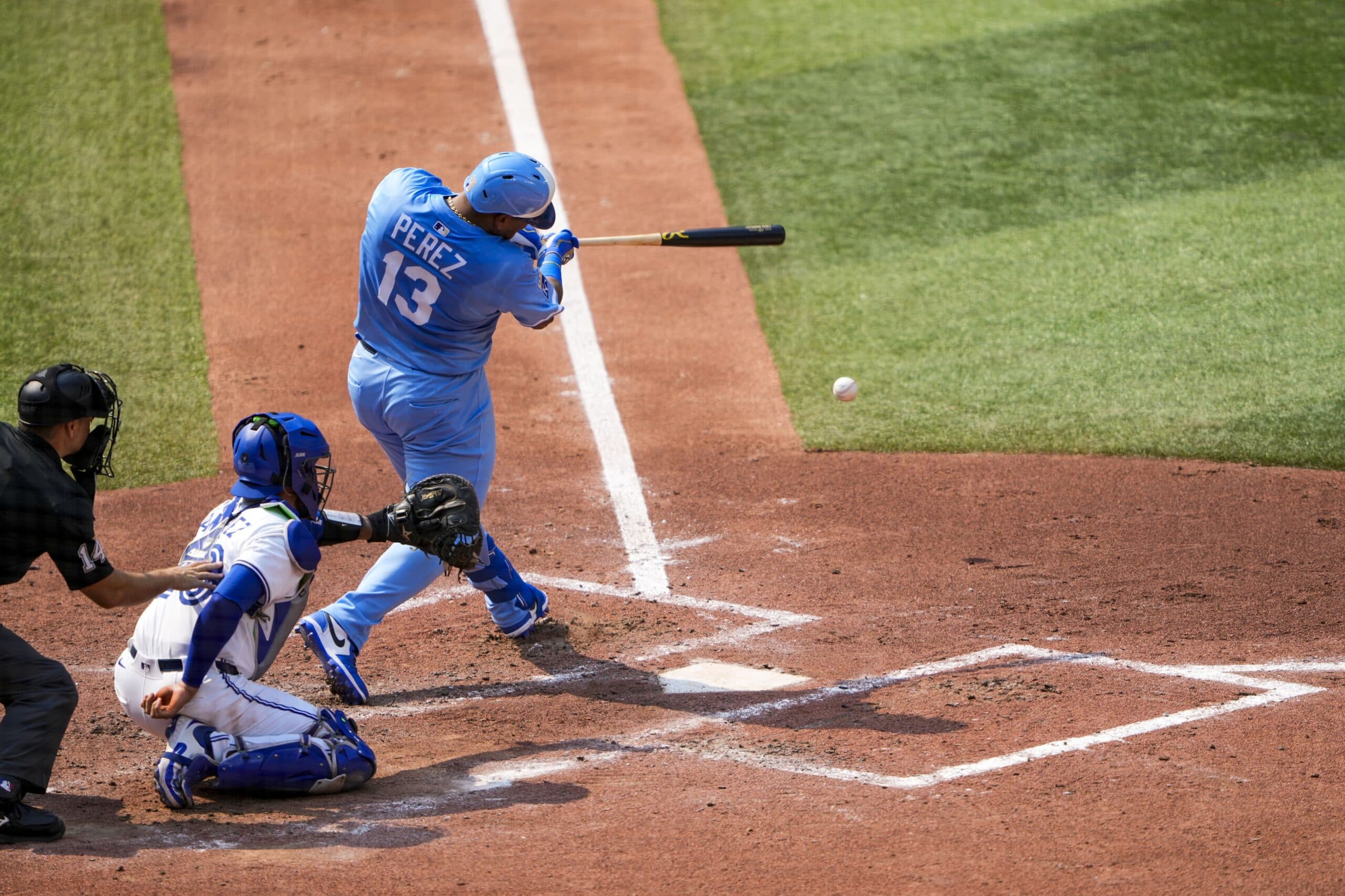 Kansas City Royals catcher Salvador Perez (13) hits a single against the Toronto Blue Jays during the fourth inning at Rogers Centre.