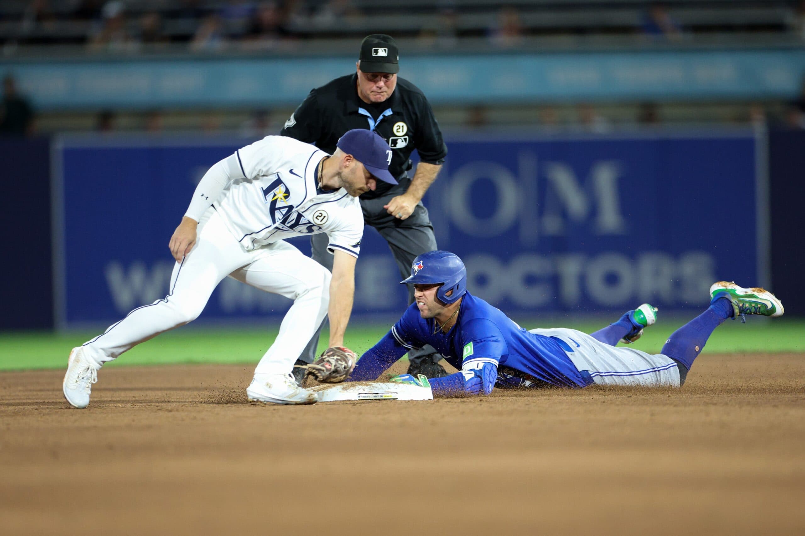 Toronto Blue Jays designated hitter George Springer (21) slides into second base on a double against the Tampa Bay Rays in the third inning at George M. Steinbrenner Field