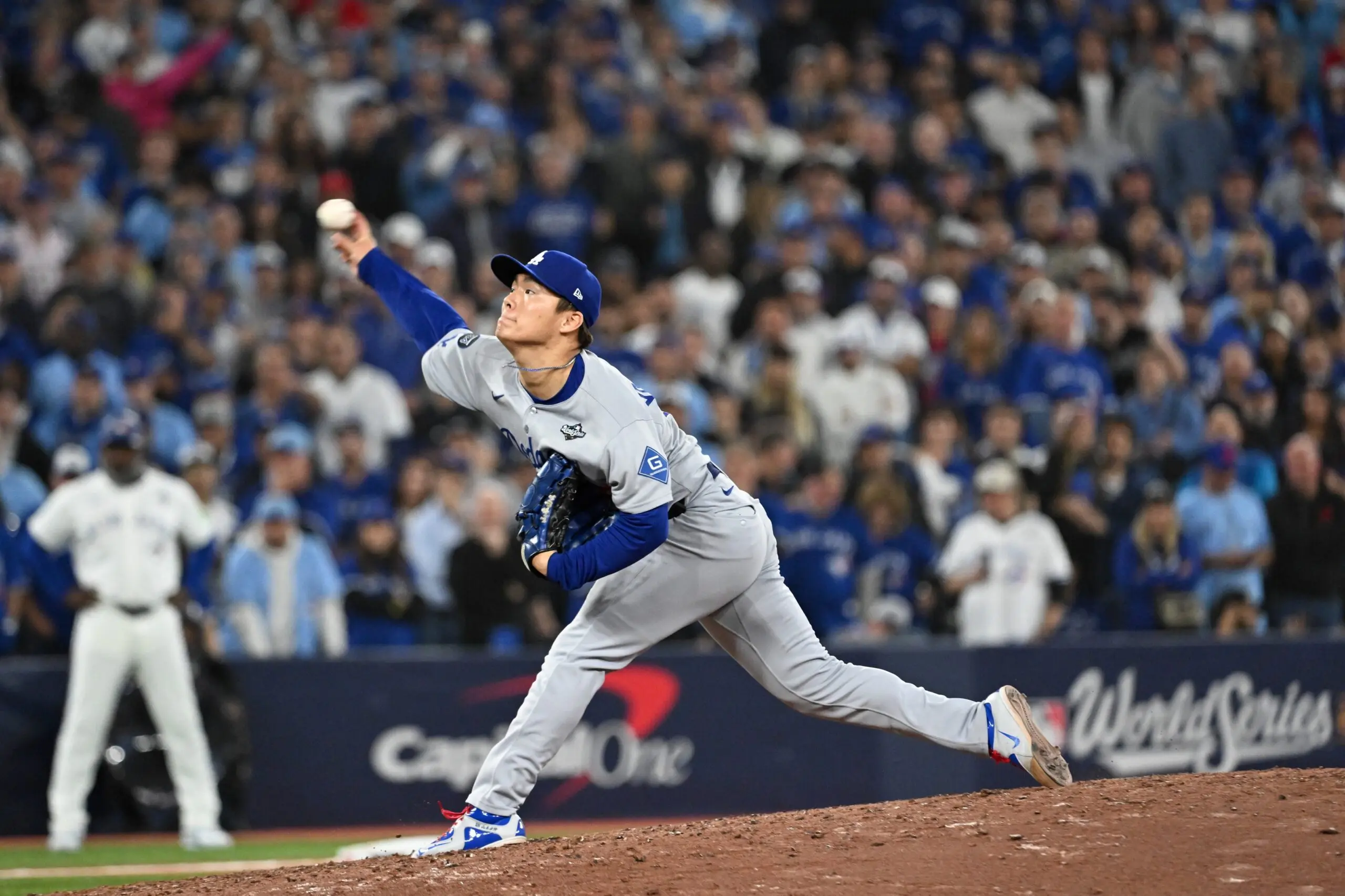 Los Angeles Dodgers pitcher Yoshinobu Yamamoto (18) throws a pitch against the Toronto Blue Jays in the ninth inning during game two of the 2025 MLB World Series at Rogers Centre.